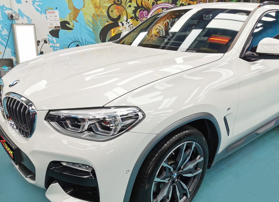 The X4's coated paintwork showing clean reflections.