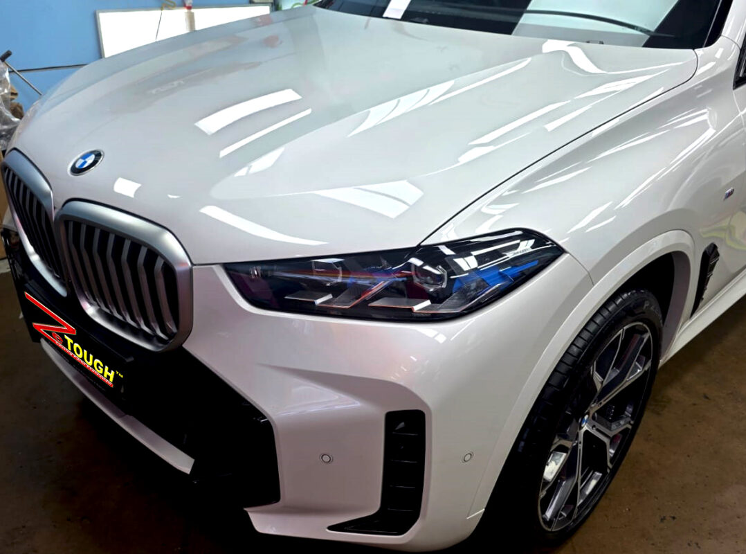 The BMW X5 from a side angle after the ceramic coating.