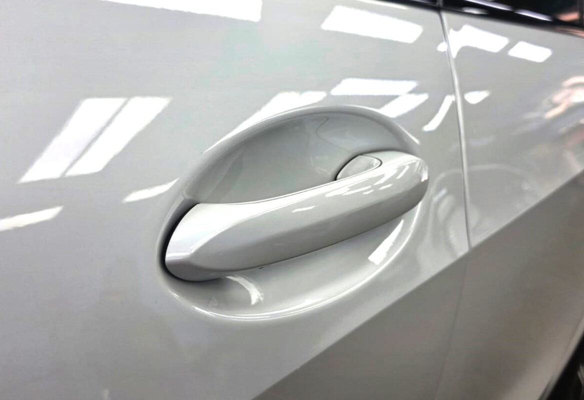 Rear quarter of the BMW X5, glossy and protected.