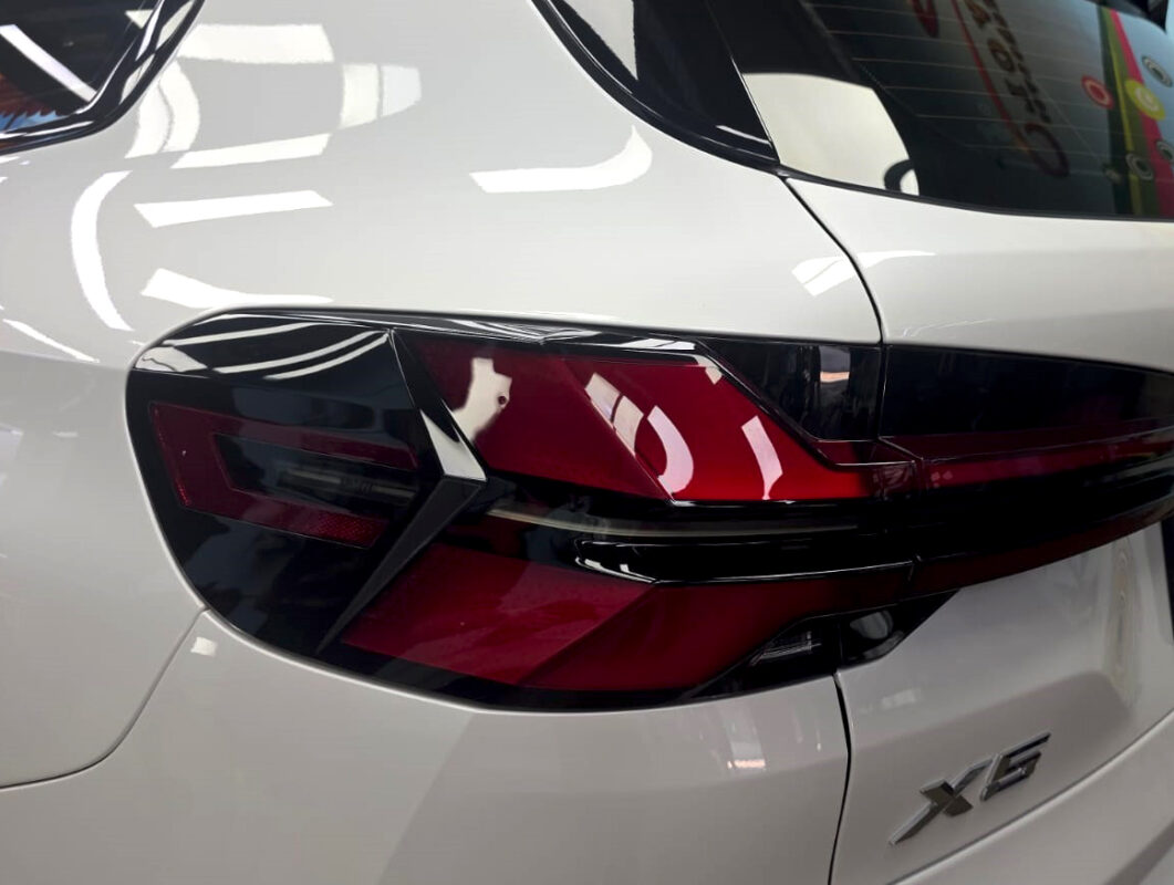 The BMW X5 parked in the workshop, freshly coated.