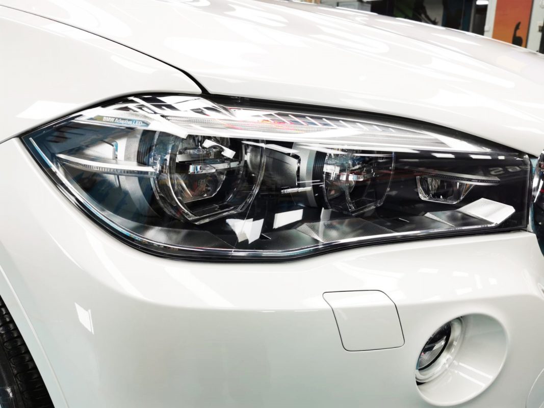 The X5's coated paintwork showing clean reflections.