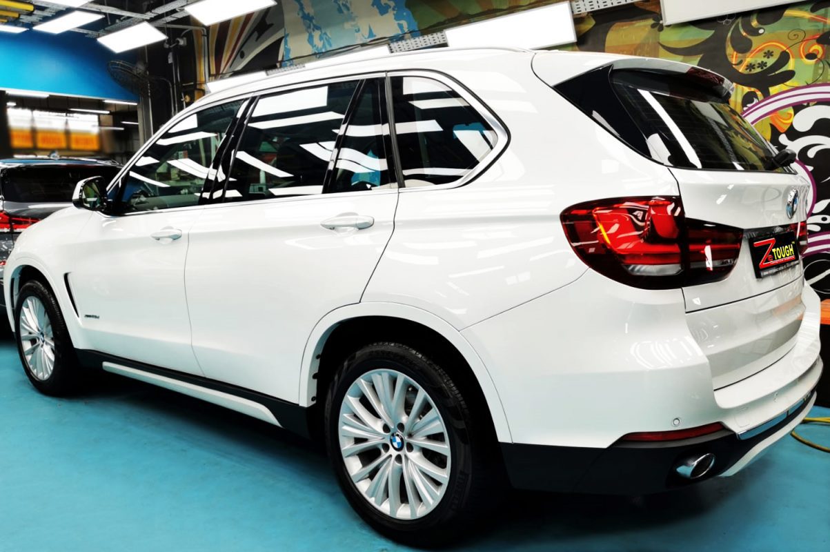 Rear quarter of the BMW X5, glossy and protected.