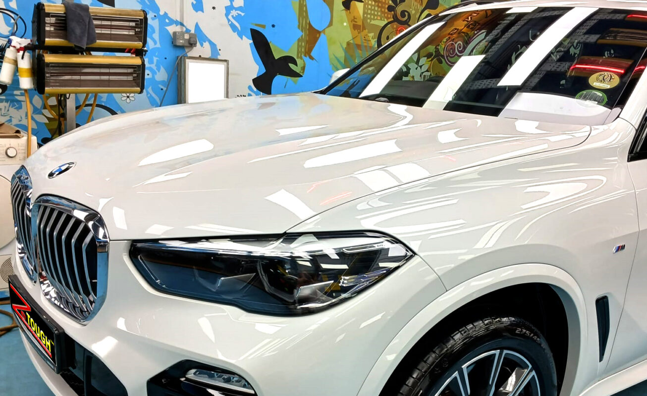The BMW X5 from a side angle after the ceramic coating.