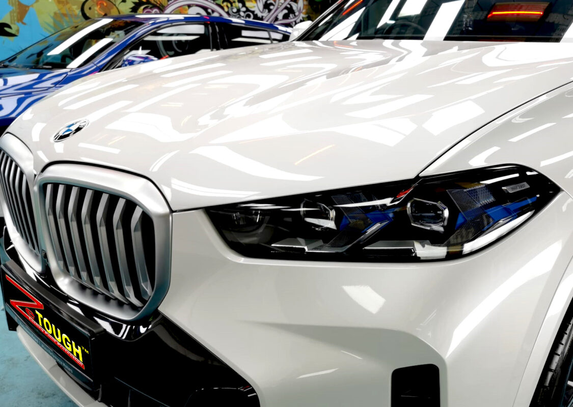 The BMW X5 from a side angle after the ceramic coating.