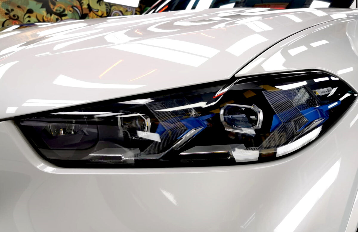 The X5's coated paintwork showing clean reflections.