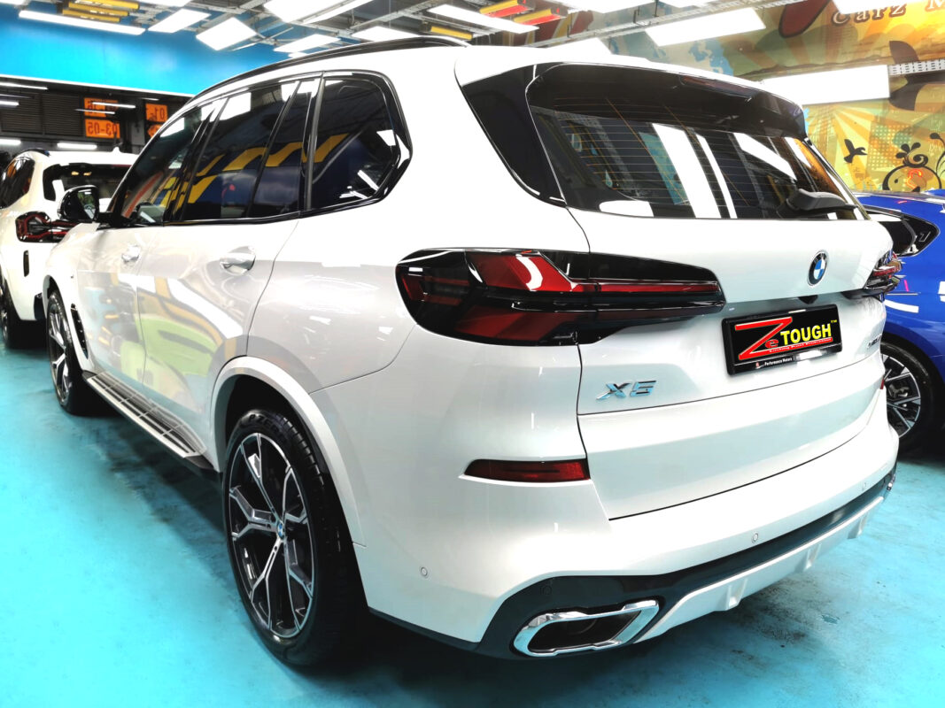 Rear quarter of the BMW X5, glossy and protected.