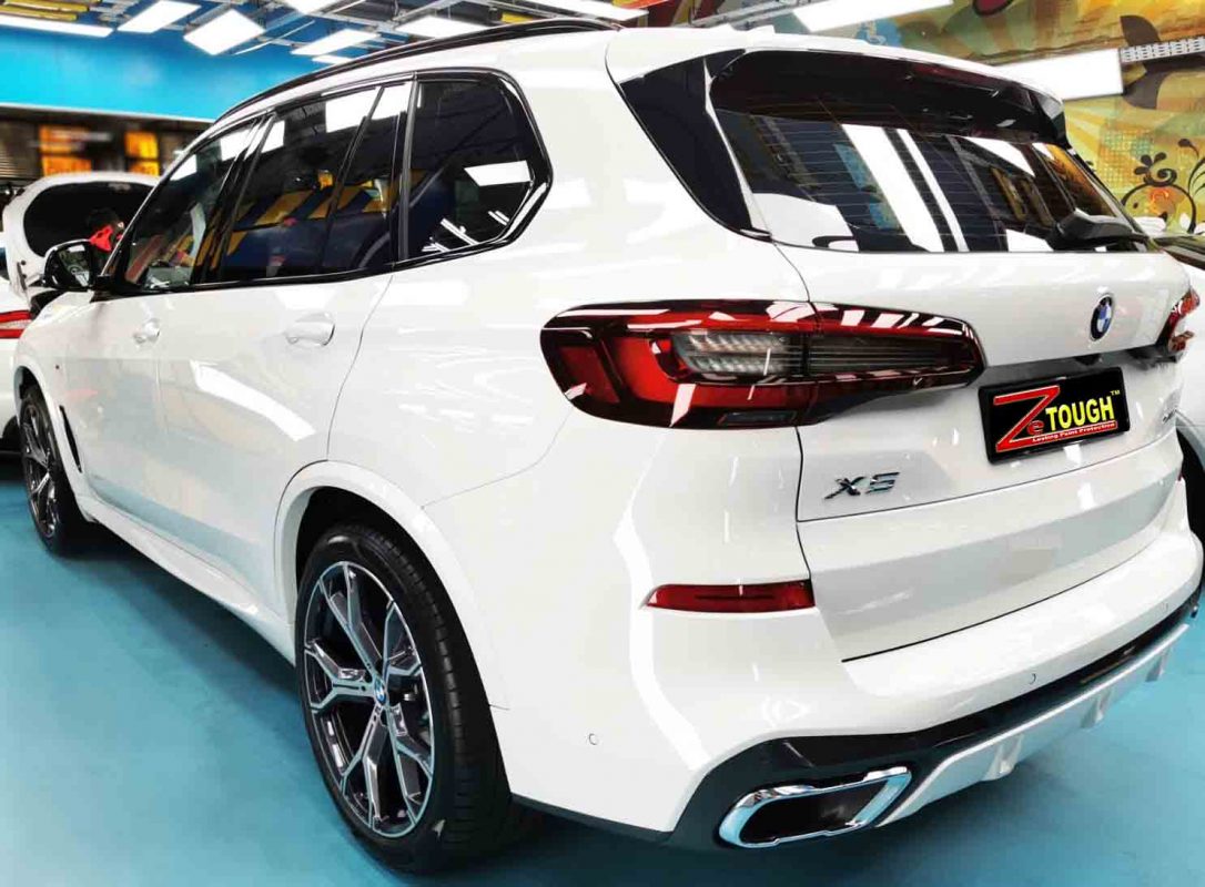 Rear quarter of the BMW X5, glossy and protected.