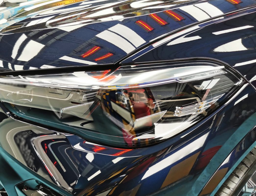 The X5's coated paintwork showing clean reflections.