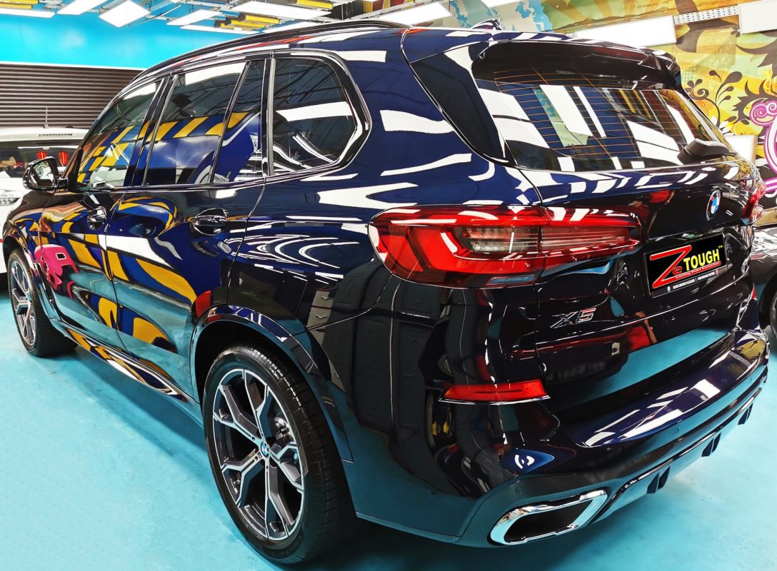 Rear three-quarter view of the coated X5.