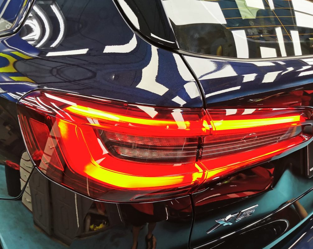 The bonnet of the X5 under workshop lighting.