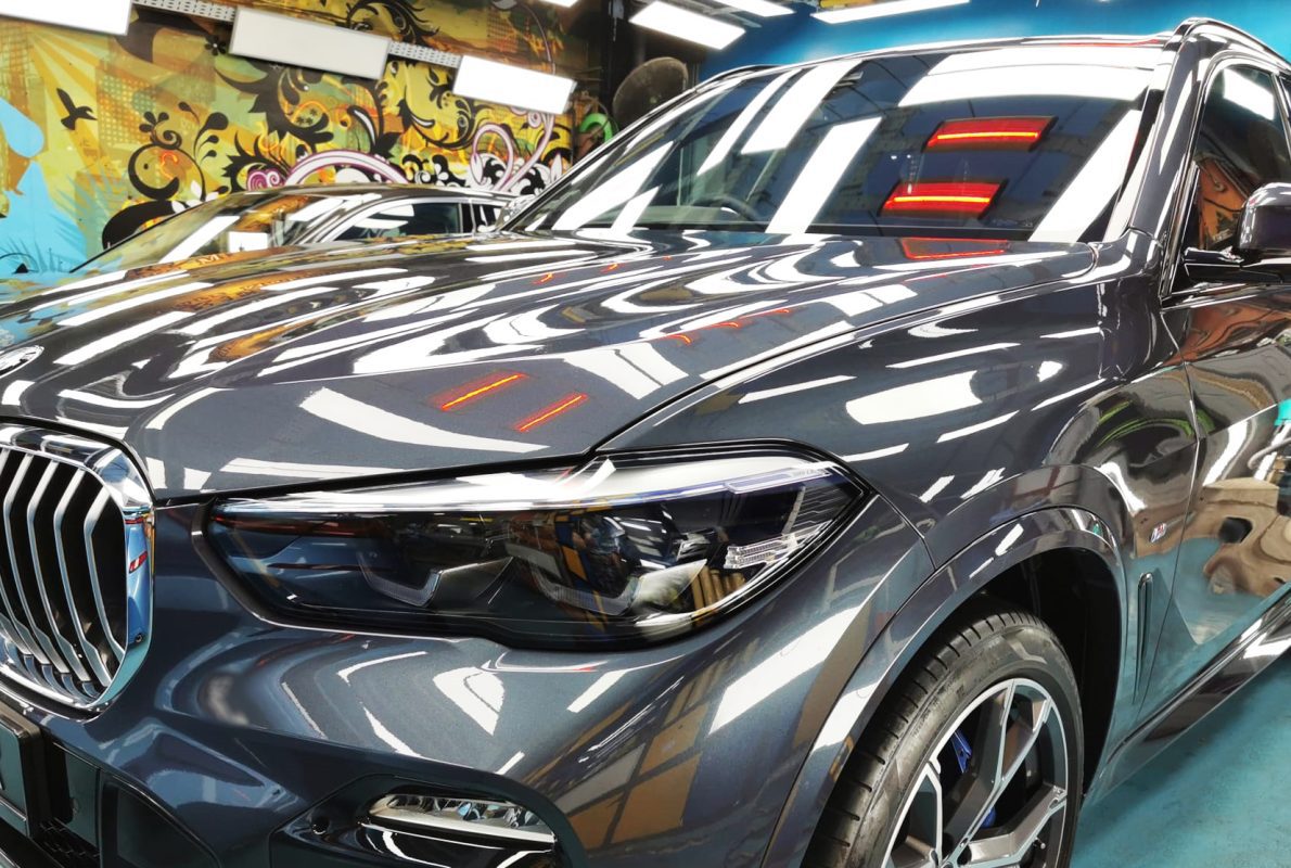 The BMW X5 from a side angle after the titanium coating.