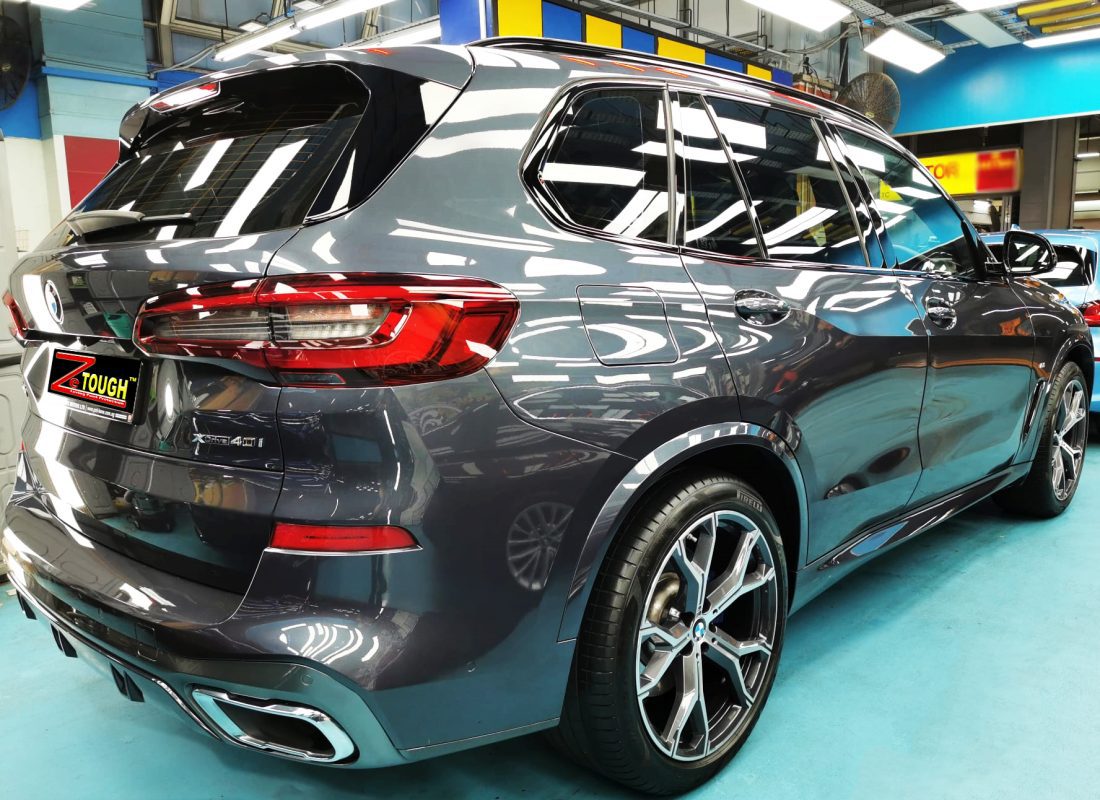 Rear quarter of the BMW X5, glossy and protected.