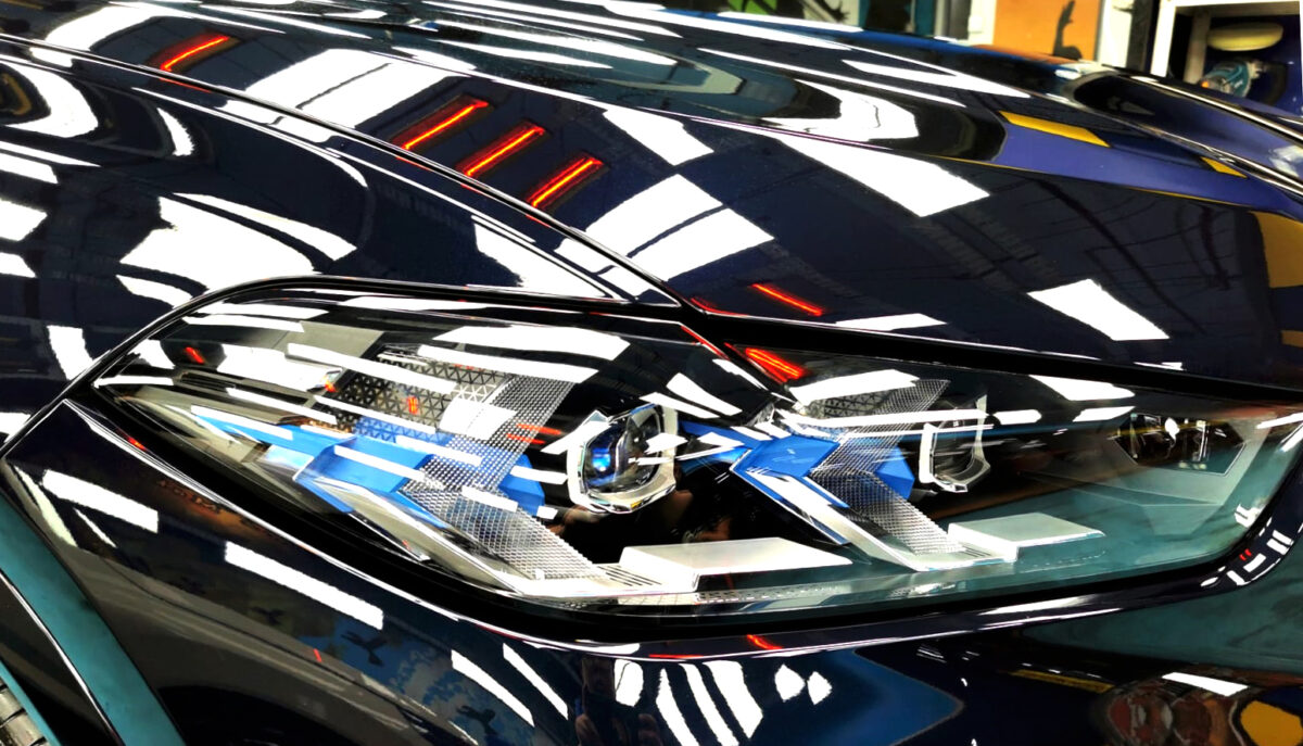 The X6's coated paintwork showing clean reflections.