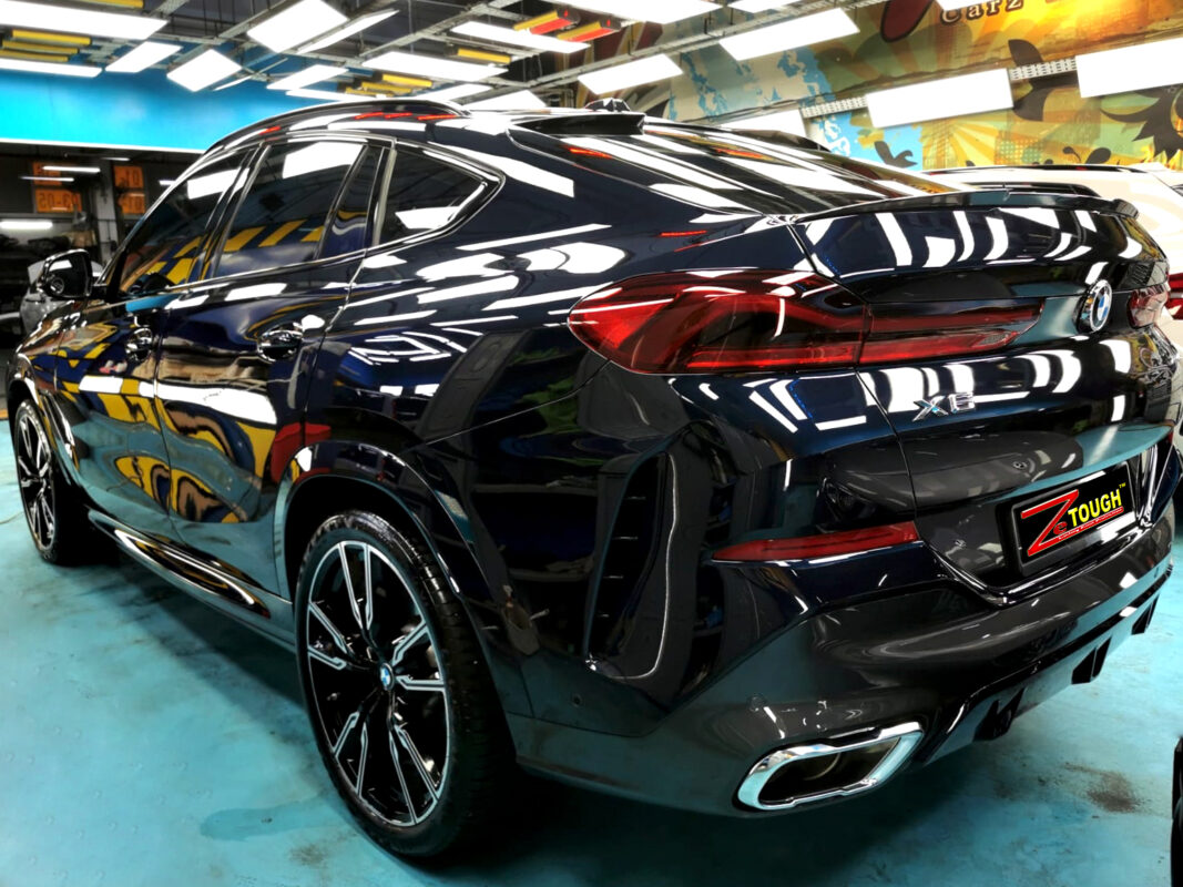 Rear quarter of the BMW X6, glossy and protected.