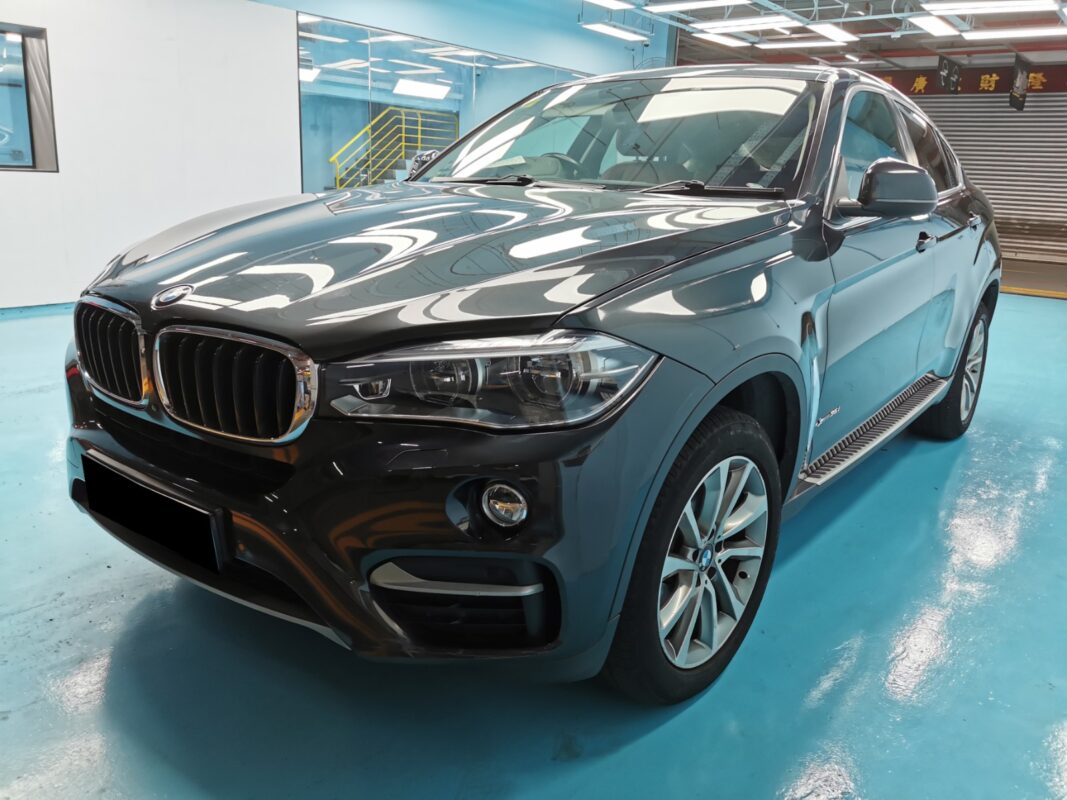 The BMW X6 as it arrived at Revol Carz, showing dull and blemished paintwork.
