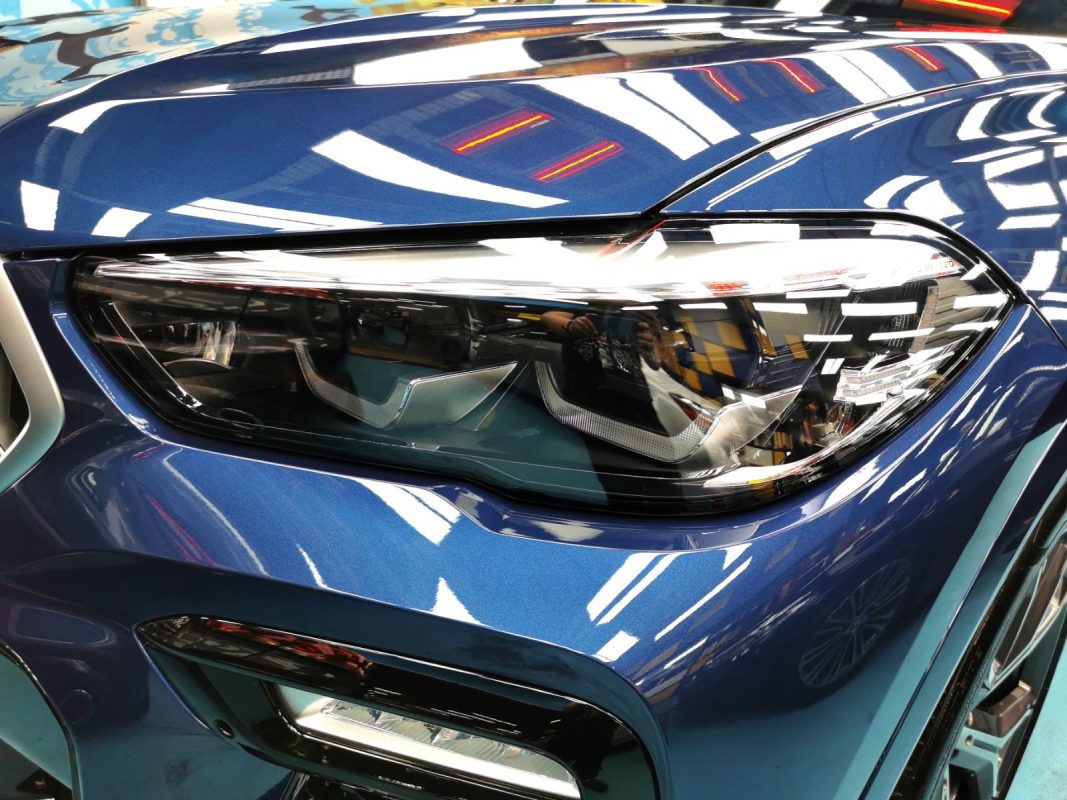 The X6's coated paintwork showing clean reflections.