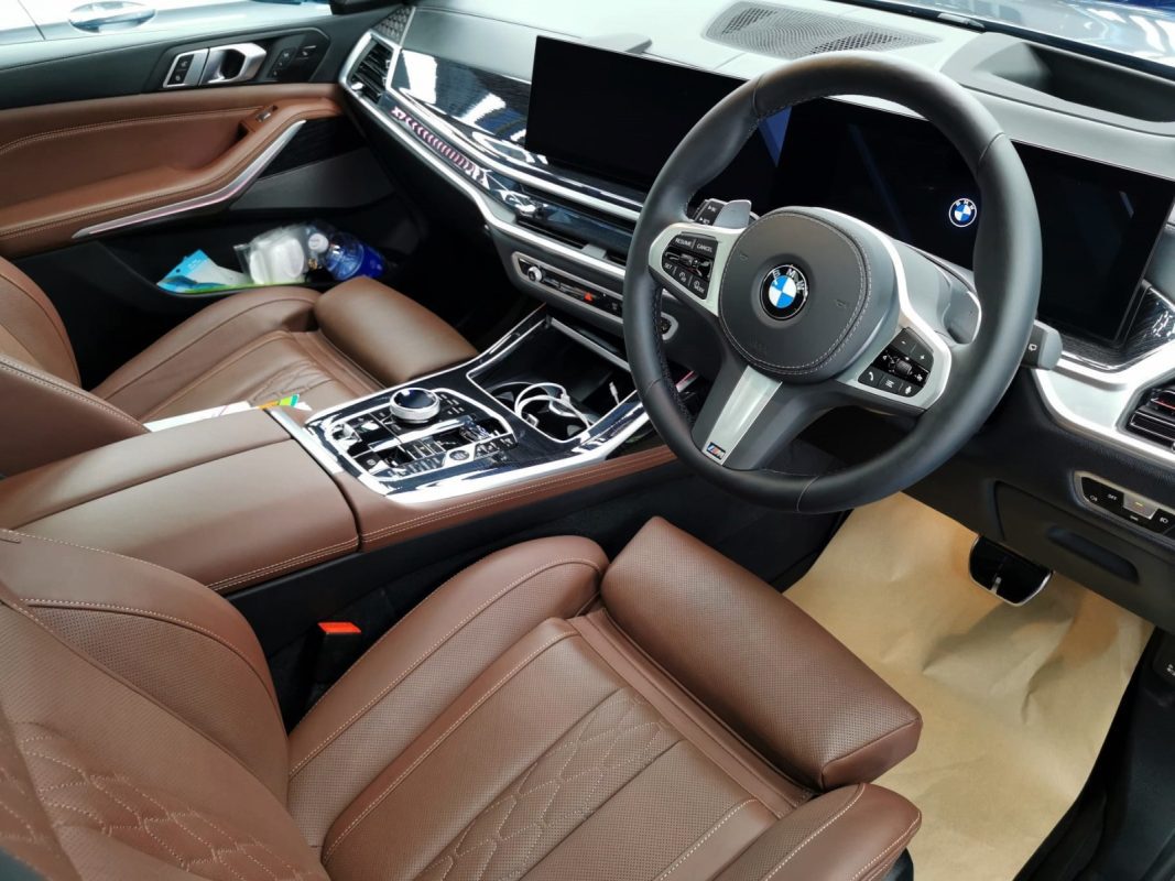 The BMW X7 parked in the workshop, freshly coated.