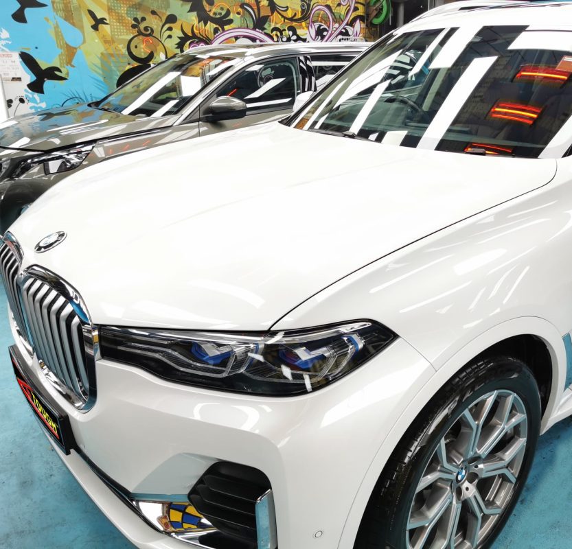 The BMW X7 from a side angle after the titanium coating.