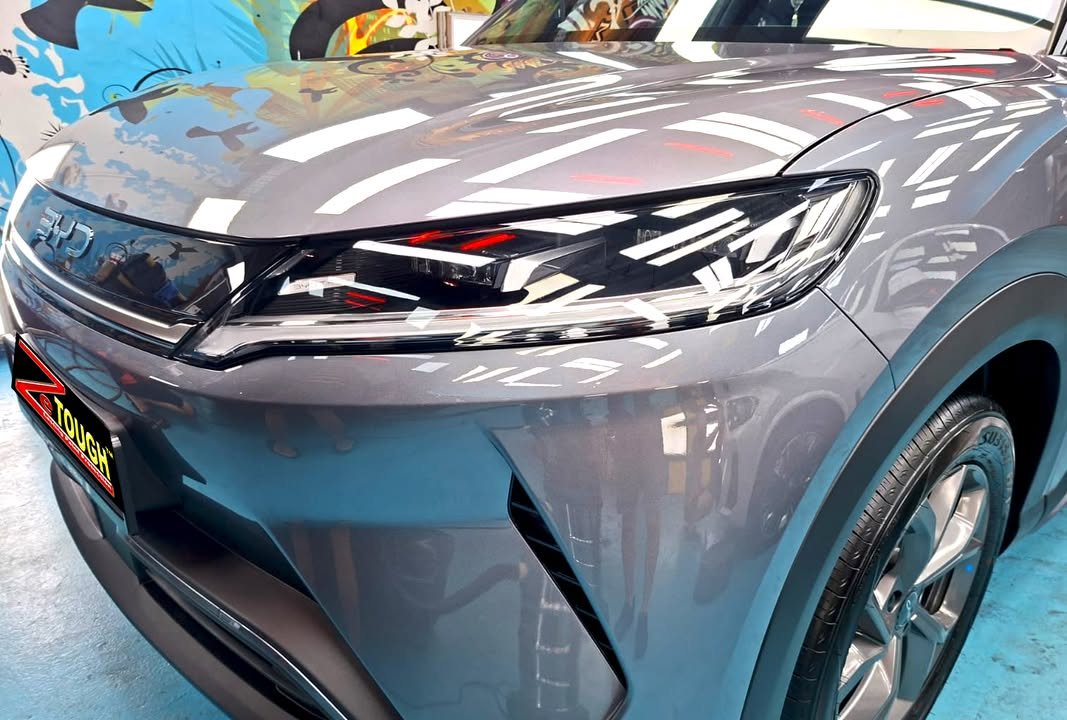 Front of the grey Atto 2 showing the headlamp and gloss on the bonnet.