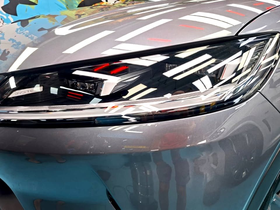 Close-up of the Atto 2 headlamp with ceiling lights reflected.