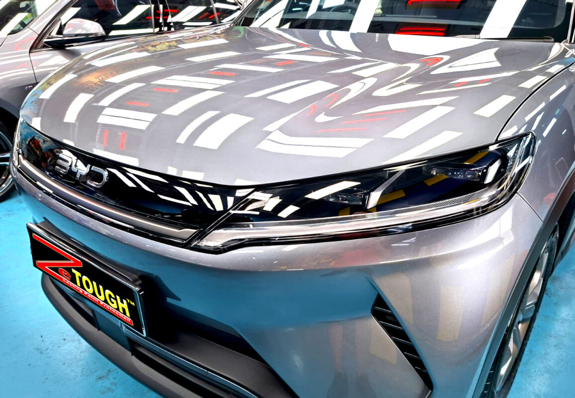 The BYD Atto 2's coated paintwork under workshop lighting.