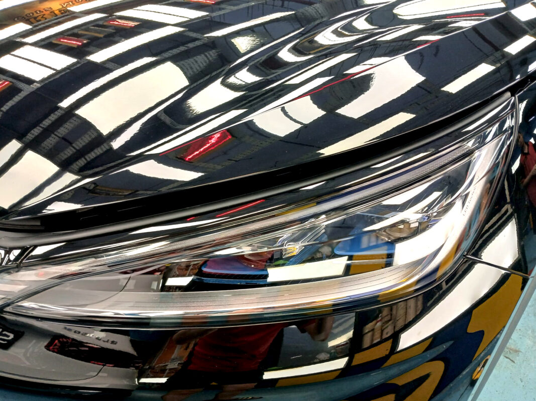 The ATTO 3's coated paintwork showing clean reflections.