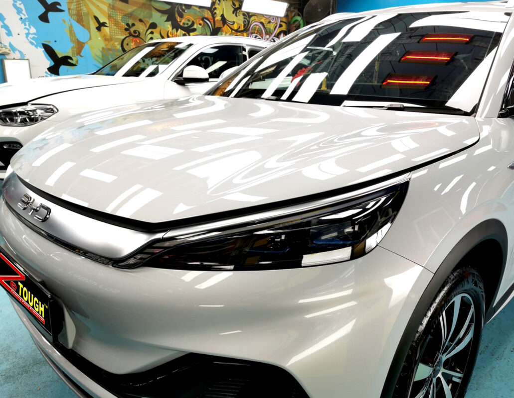 The BYD Atto 3's coated paintwork under workshop lighting.