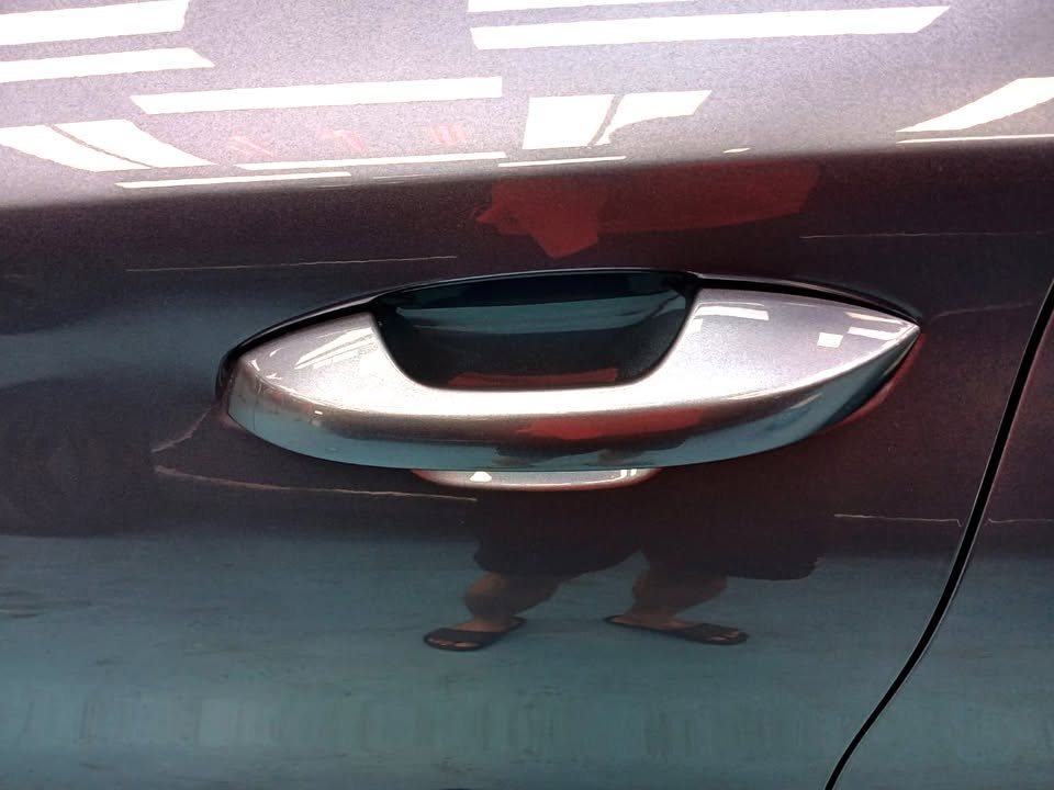 Grey-blue door panel and handle.