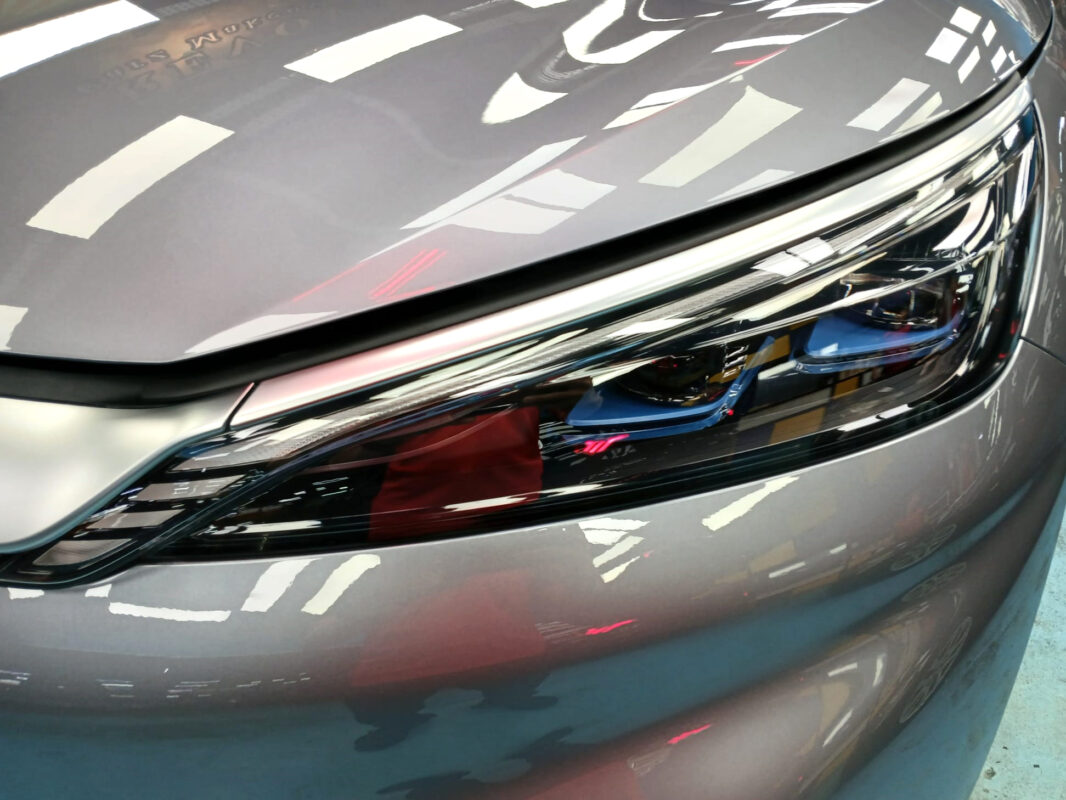 The ATTO 3's coated paintwork showing clean reflections.