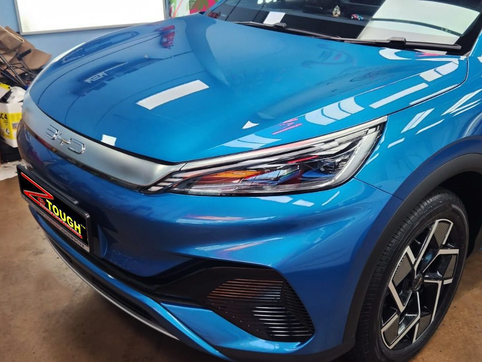The BYD Atto 3 from a side angle after the ceramic coating.