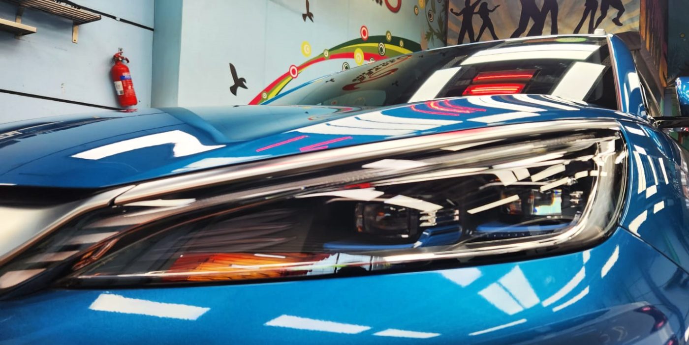 The Atto 3's coated paintwork showing clean reflections.