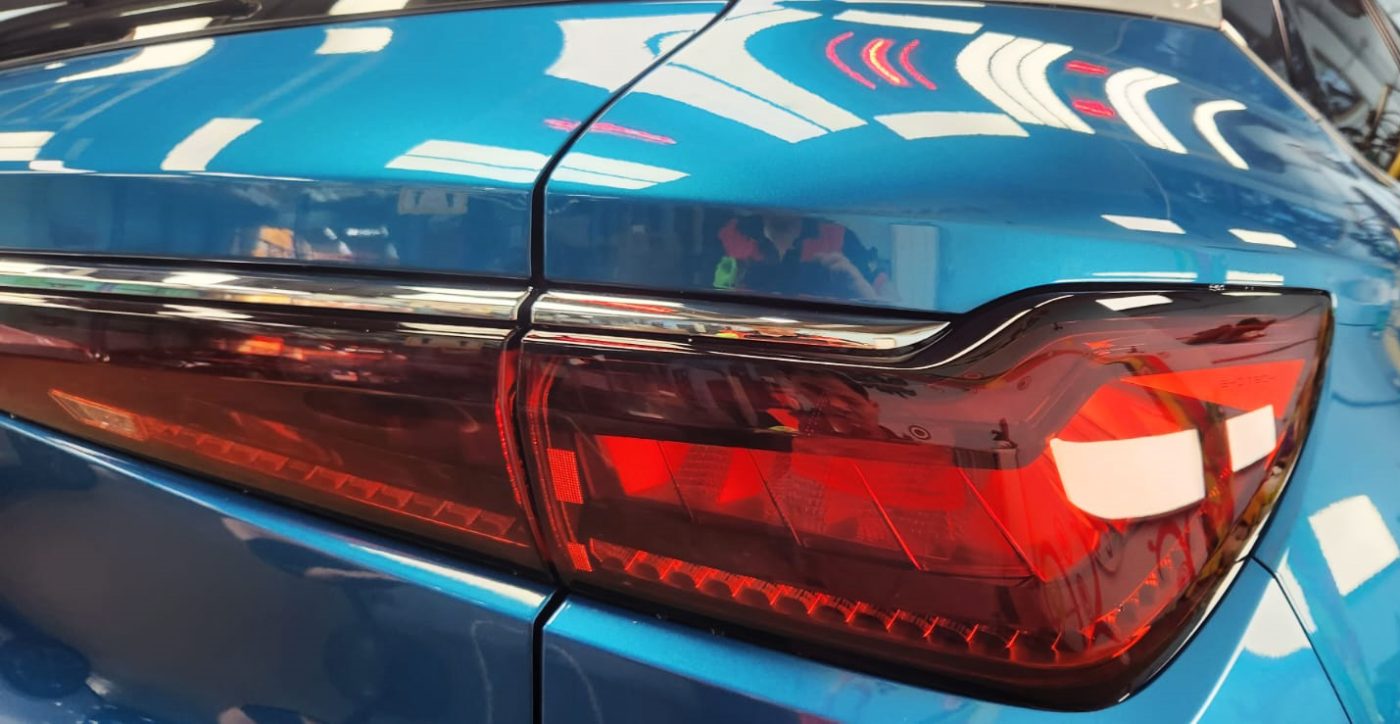 The coated bonnet of the BYD Atto 3 under workshop lighting.