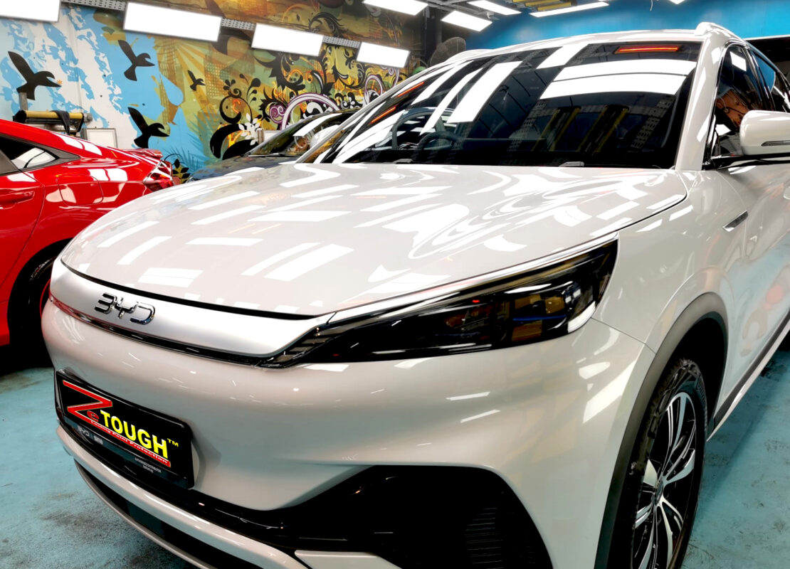 The BYD Atto 3 from a side angle after the ceramic coating.