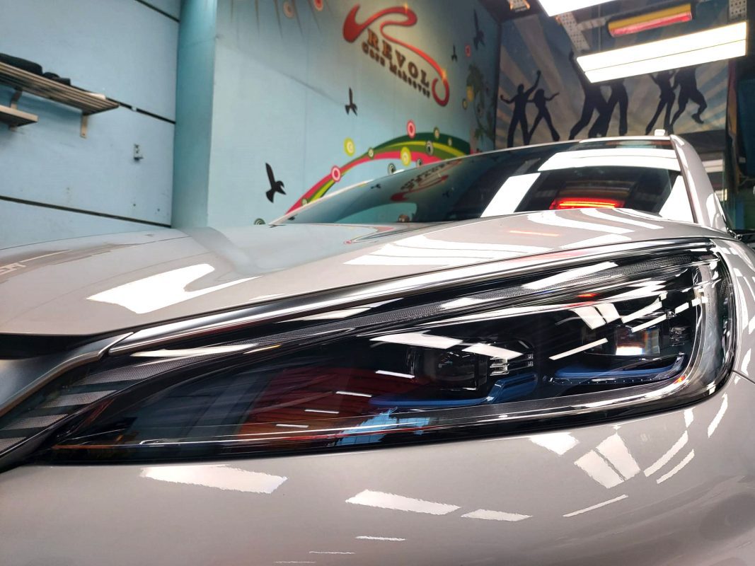 The Atto 3's coated paintwork showing clean reflections.