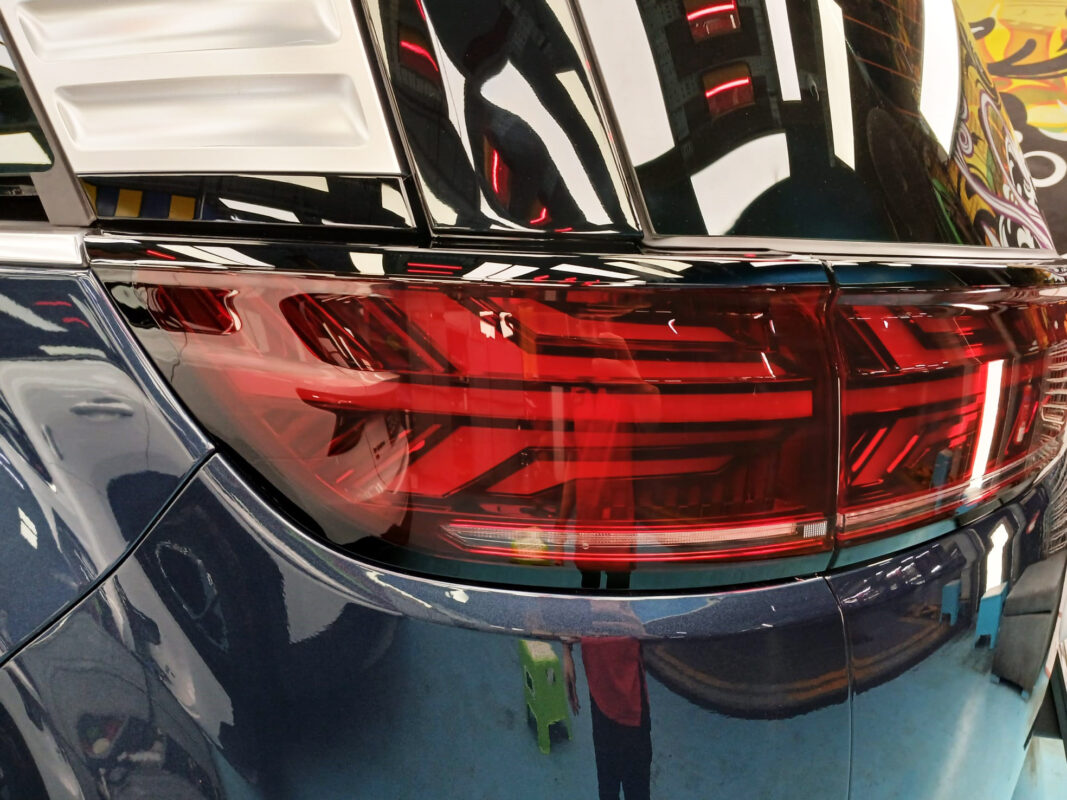 Rear quarter of the BYD DENZA D9, glossy and protected.
