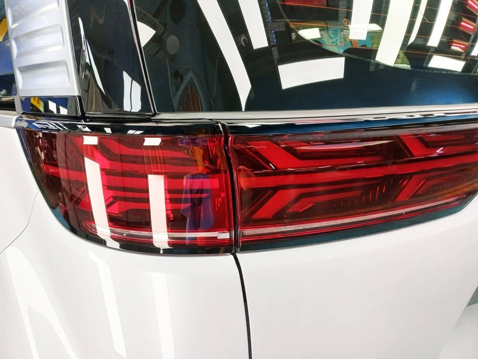 Close-up of the Denza D9 tail lamp against the white body.