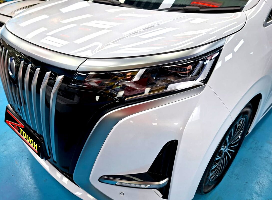 The BYD Denza D9's coated paintwork under workshop lighting.