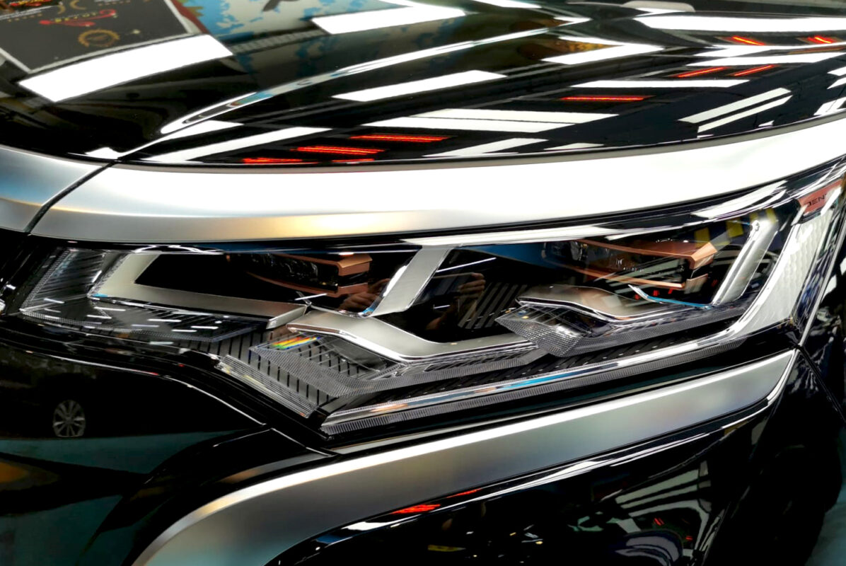 The Denza's coated paintwork showing clean reflections.