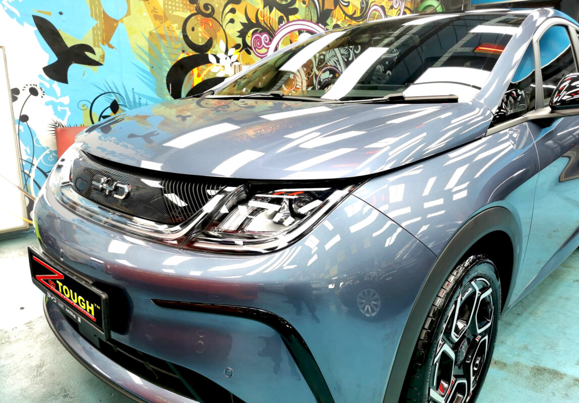 The BYD Dolphin from a side angle after the ceramic coating.
