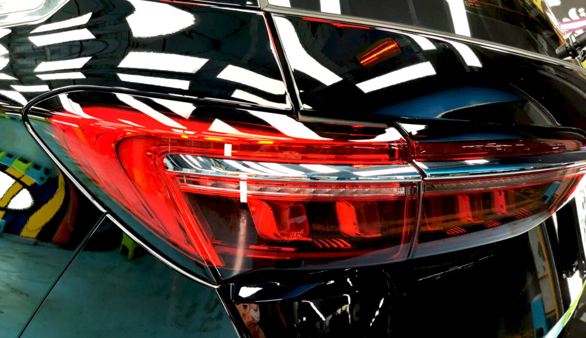 The BYD M6 parked in the workshop, freshly coated.