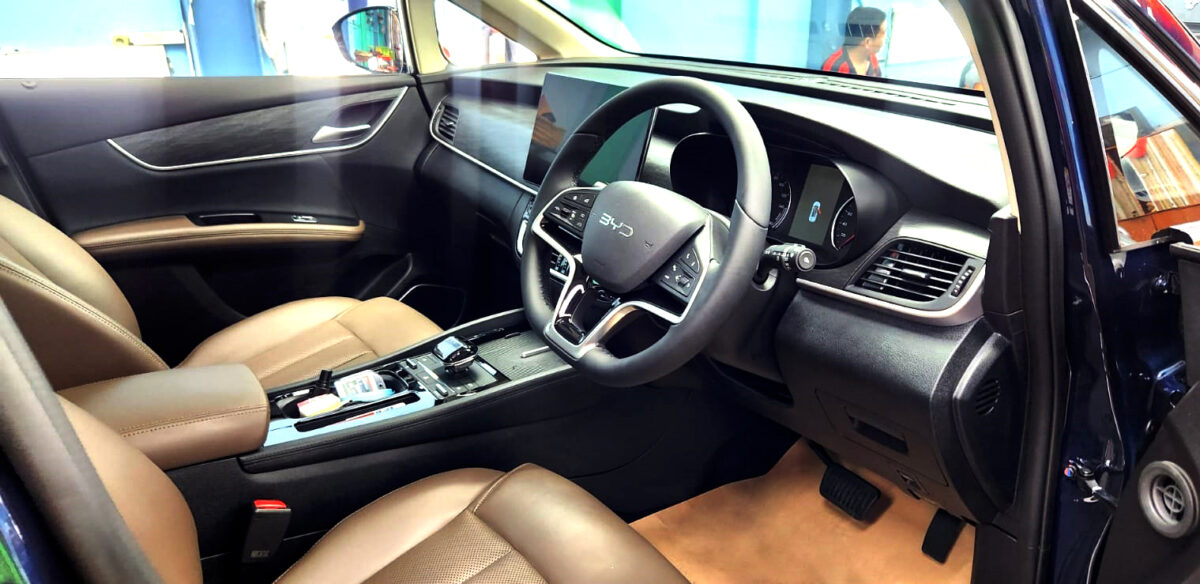The BYD M6 parked in the workshop, freshly coated.