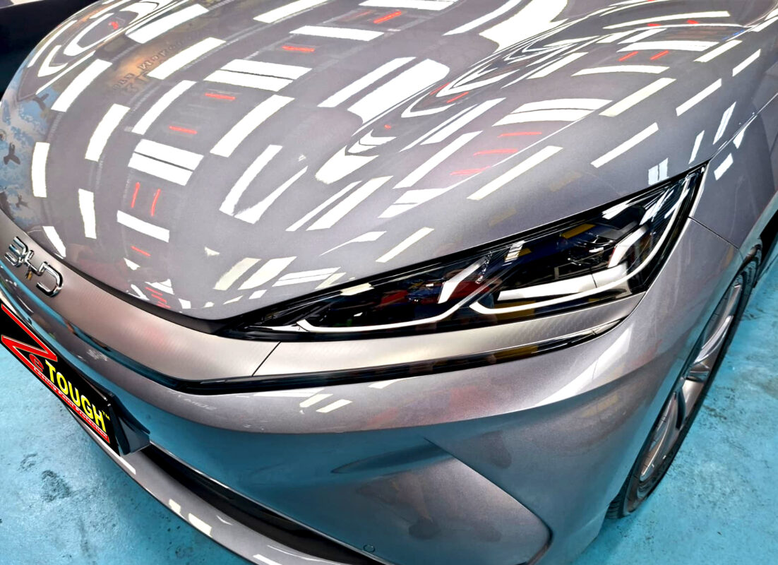 The BYD Seal 6's coated paintwork under workshop lighting.
