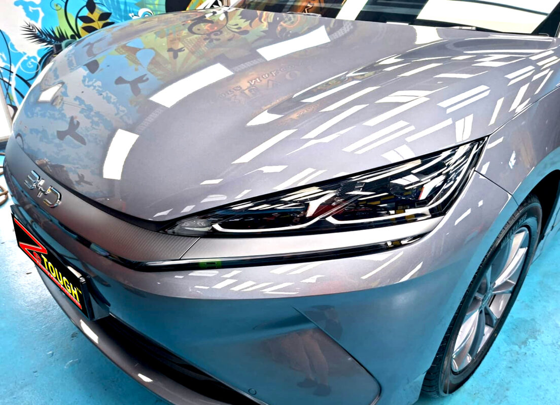 The BYD Seal 6's coated paintwork under workshop lighting.