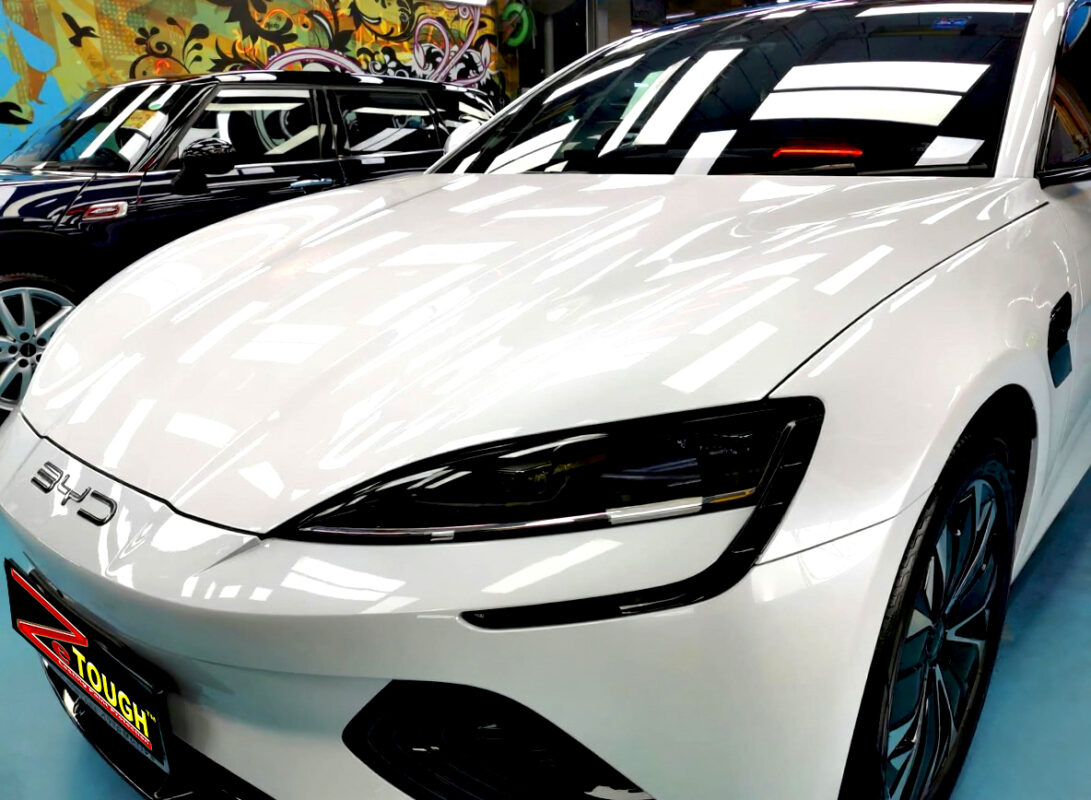 The BYD Seal's coated paintwork under workshop lighting.
