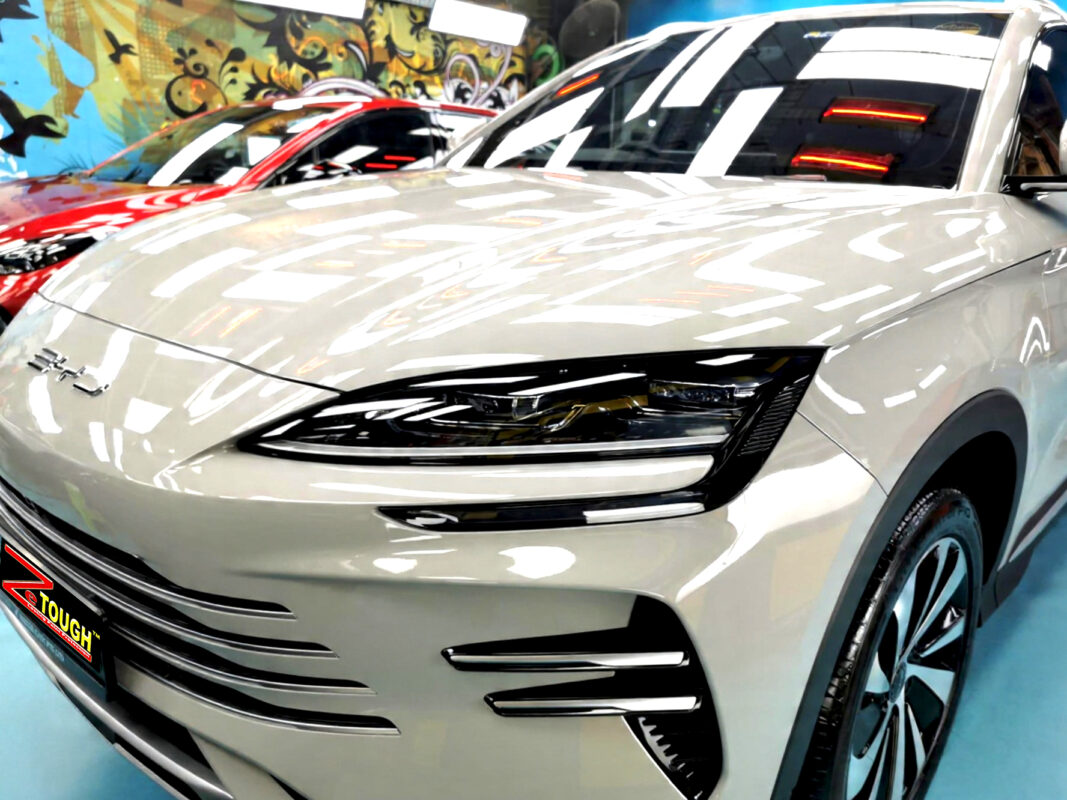 The BYD Sealion 6's coated paintwork under workshop lighting.