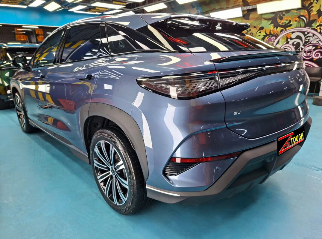 Rear quarter of the BYD Sealion 7, glossy and protected.