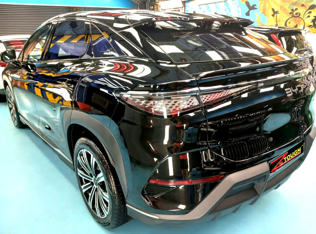 Rear quarter of the BYD Sealion 7, glossy and protected.