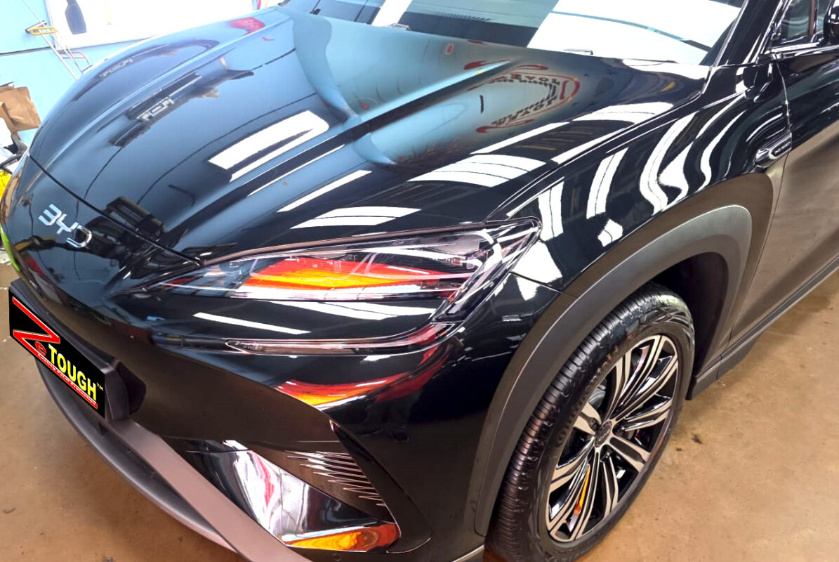 The BYD Sealion 7's coated paintwork under workshop lighting.
