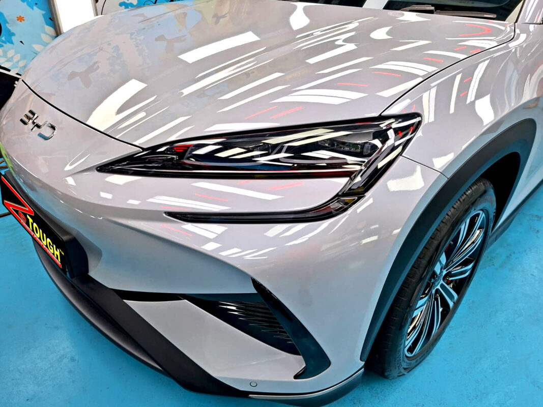 The BYD Sealion 7's coated paintwork under workshop lighting.