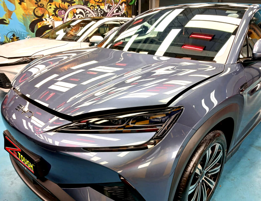The BYD Sealion 7's coated paintwork under workshop lighting.